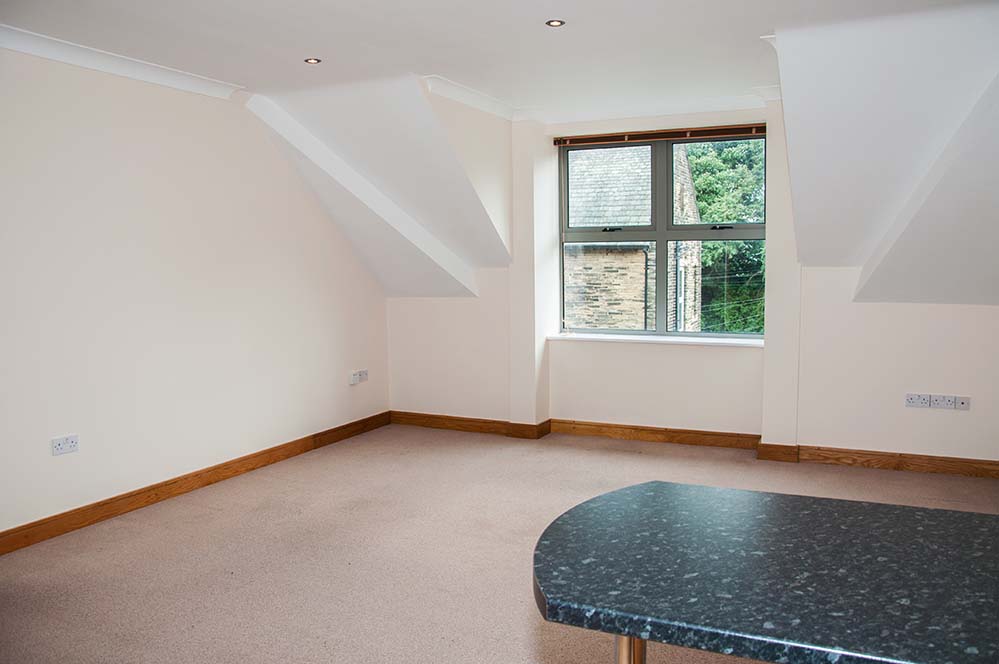 Empty room with carpeted floors and one window