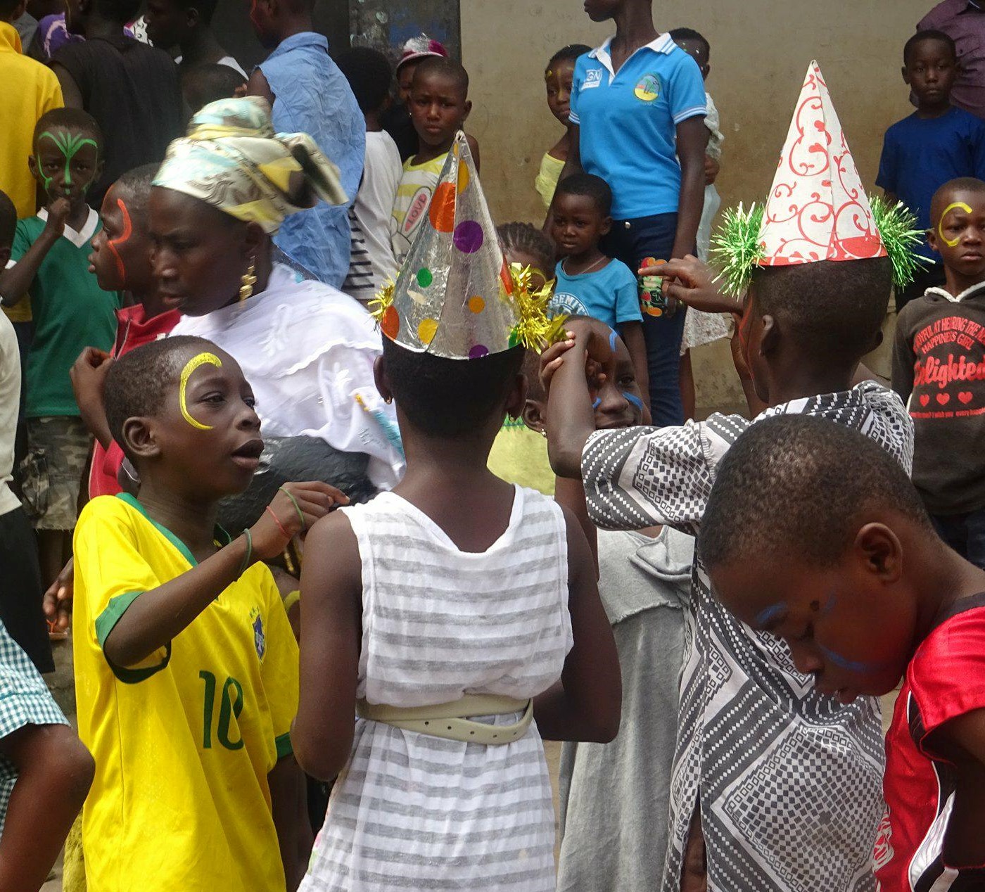 A group of children with party hats on
